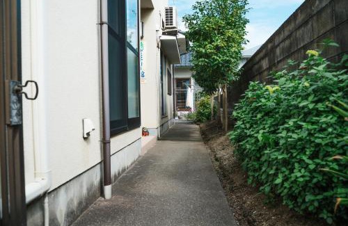 Hoshinooka Casa | 木の家ゲストハウス松山本館