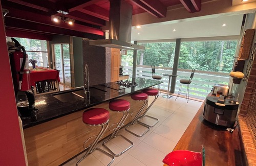 Northlake Casa | 5-Bedroom 6000SF wood and glass retreat in Atlanta, surrounded by greenery.