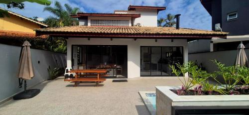 Costa do Sol Casa | 50m praia Cond pé na areia Alto padrao 4 suites Segur 24h Costa do sol Guaratuba Bertioga prox Riviera