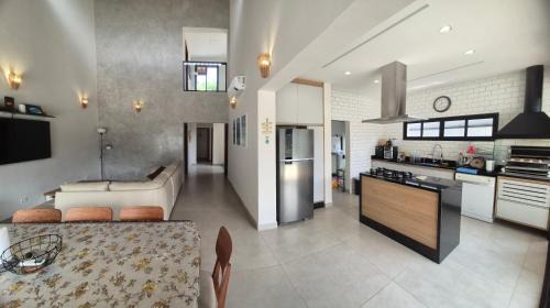 Costa do Sol Casa | 50m praia Cond pé na areia Alto padrao 4 suites Segur 24h Costa do sol Guaratuba Bertioga prox Riviera