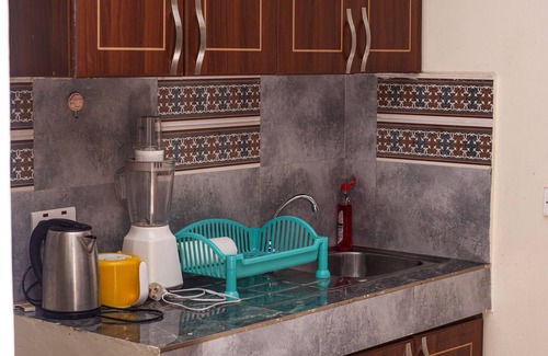 Bukoto Apartamento | A quiet one bedroom set with small gym and swimming pool.