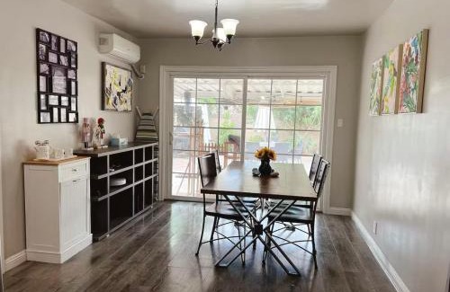 Norwalk Casa | A small room in the backyard with a full bed