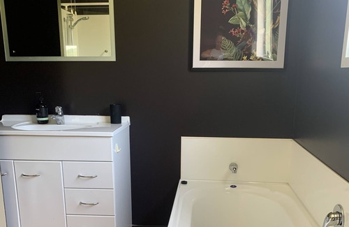 Awhitu Casa | A sunset paradise, 3 bedroom home on a hill with views to the ocean