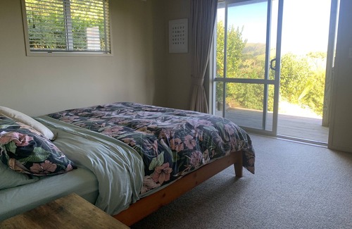 Awhitu Casa | A sunset paradise, 3 bedroom home on a hill with views to the ocean