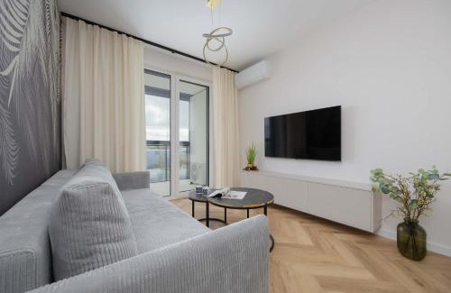 Wlochy Apartamento | Beige Apartment in Warsaw with Parking and Air Conditioned Living Room by Noclegi Renters