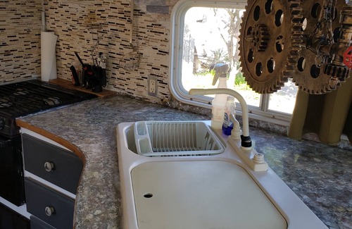 Eastside Promise Neighborhood Alquiler De RV | Camper located inside Texas Renasaince Faire. Set up and ready to enjoy
