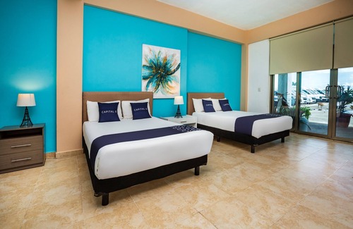 Alfredo V. Bonfil Hotel | Capital O Cancun International Airport 24/7,