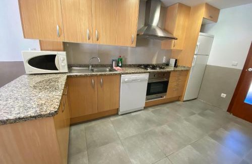 L'Escala Casa | Casa l'Escala, piscina comuntària i jardí privat