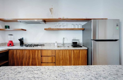 Puerto Aventuras Apartamento | Casa Manglar Puerto Aventuras Pool and Garden View