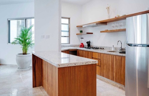 Puerto Aventuras Apartamento | Casa Manglar Puerto Aventuras Pool and Garden View