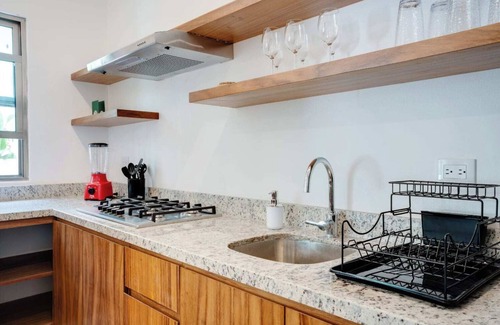 Puerto Aventuras Apartamento | Casa Manglar Puerto Aventuras Pool and Garden View