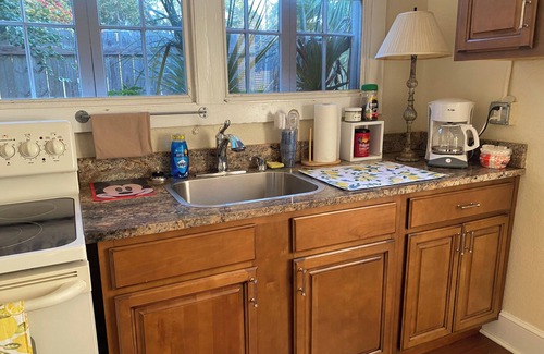 Polk City Cabaña | Charming Historic Cottage with Cozy Porch and Garden Retreat