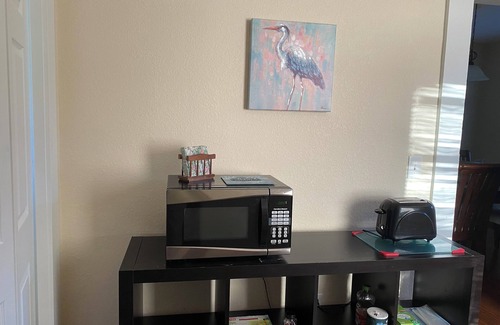 Polk City Cabaña | Charming Historic Cottage with Cozy Porch and Garden Retreat