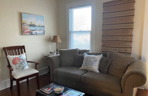 Polk City Cabaña | Charming Historic Cottage with Cozy Porch and Garden Retreat