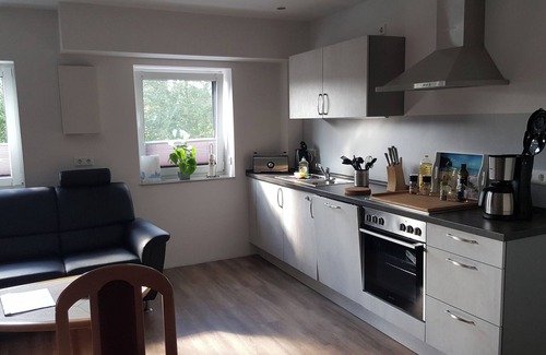 Scholderup Apartamento | Chic vacation home, nestled in the beautiful Schleil landscape, 53 square meters of living space, for up to 4 people plus toddler. Facilities: Baby crib, beautiful garden area with play facilities and covered barbecue and smoking area, fly screens...