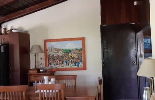 Panajachel Cabaña | Cozy country cottage with wooden ceilings and stone walls within nature reserve.