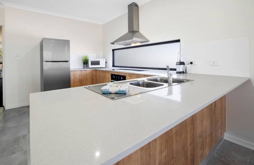 Whitsundays Villa | DIA DE SUEÑO Airlie Beach Vistas al agua y momentos para el paseo marítimo.