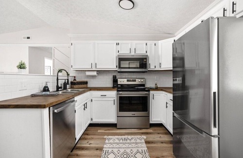 West Newton Casa | Downtown Access | 3BR Ranch Retreat with Fire-Pit