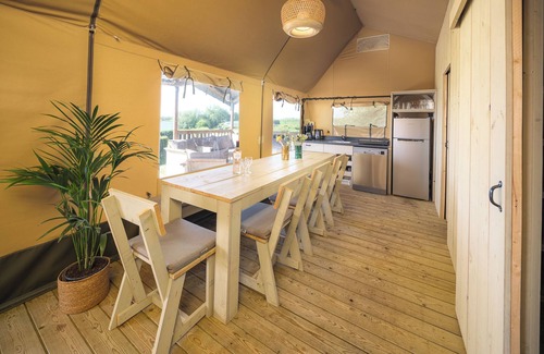 Lathum Casa | Experience luxury glamping in the elevated Safari Tent Ranger by the water.