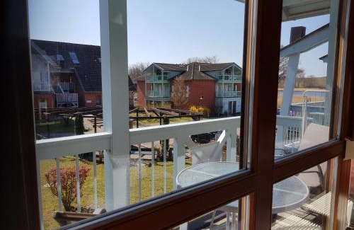 Neuensien Complejo | Ferienwohnung 4 im Haus am See mit Wintergarten und Terrasse