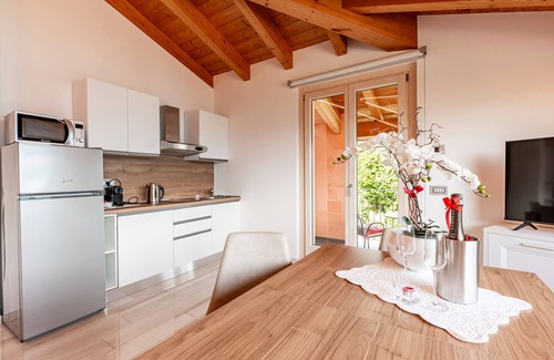 Musso Apartamento | Apartamento vacacional "Picolla Orchidea Finestra Sul Lago" con terraza privada
