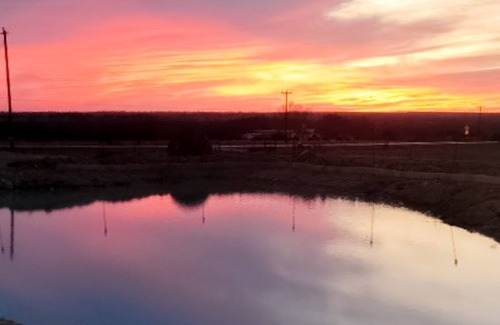 Cleburne Casa | Large barn on an acreage with water views, covered patios, fireplace, and AC