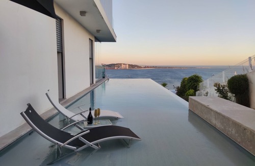 Linda-a-Velha Villa | Lisbon 3 floor 3 bedroom Villa, unique Sea View, Infinity Pool, Terrace, and Gym