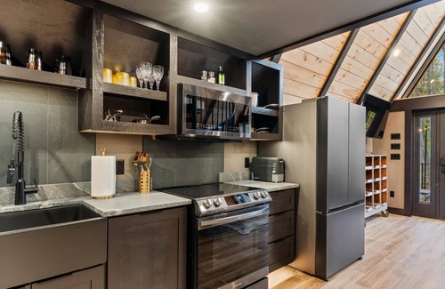 Sebago Casa | Modern A-frame house with hot tub and fire pit. Very private!