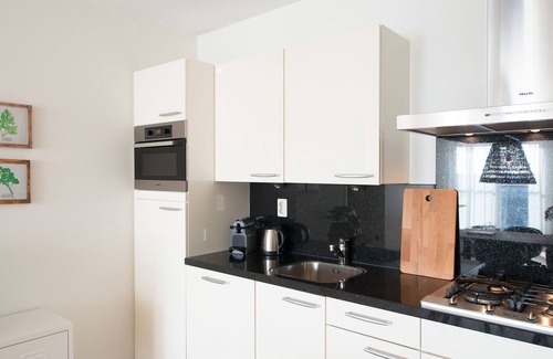 Vissershaven Apartamento | Apartamento moderno con una gran vista sobre el puerto.