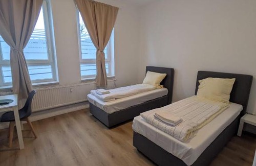 Neumuenster Apartamento | Modernes Apartment mit 2 Schlafzimmern und Privatparkplatz nahe Innenstadt