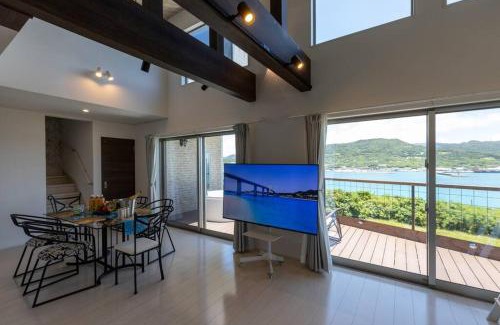 Motobu Villa | NEW!パノラマオーシャンビューのテラスジャグジーは圧巻。新築2階建て吹抜け天井リビングは開放感抜群