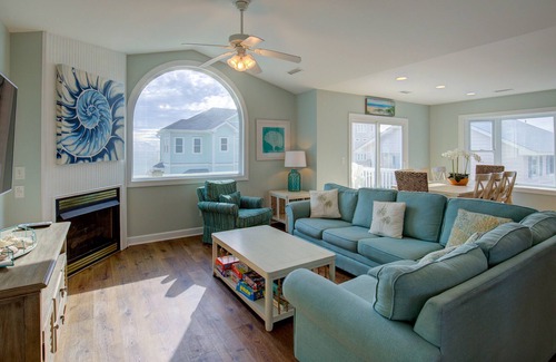 Village of Stump Sound Casa | Ocean-view 2-story home with fireplace, community outdoor pool & tennis court