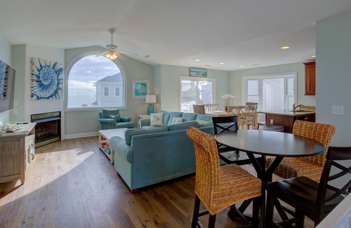 Village of Stump Sound Casa | Ocean-view 2-story home with fireplace, community outdoor pool & tennis court