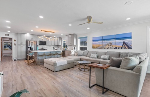 Alamitos Beach Casa | Oceanfront retreat with rooftop deck, modern interior, marble finishes, & W/D