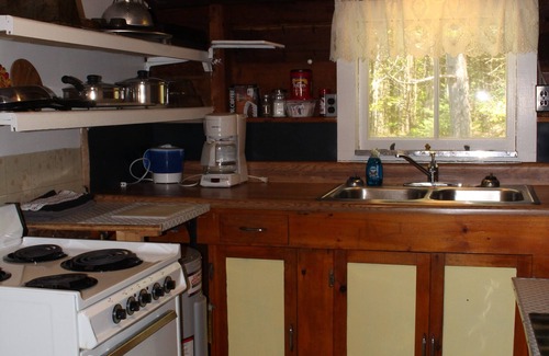 Dennysville Cabaña | Rustic, two-story, clapboard cottage, field view, Pet-friendly, Downeast Maine