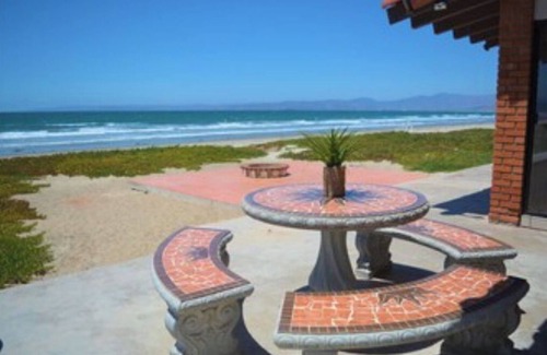 Lengüeta Arenosa Casa | Searenity Keep an eye on kids. You: on patio with a refreshing beverage.
