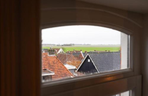 Eenrum Apartamento | Sfeervol verblijf in oude gemeentehuis Eenrum.