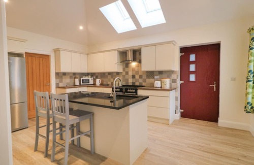 Downpatrick Cabaña | Sliabh Amharc