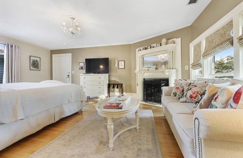 Sturgeon Bay Hotel | Spacious King bed suite with private balcony.