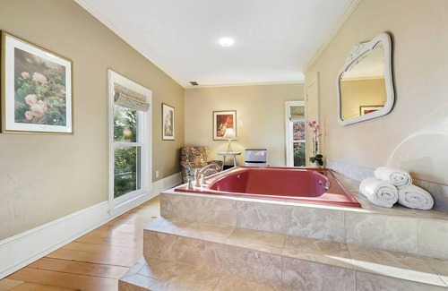 Sturgeon Bay Hotel | Spacious King bed suite with private balcony.