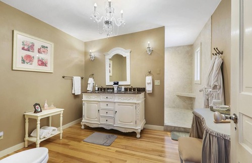 Sturgeon Bay Hotel | Spacious King bed suite with private balcony.