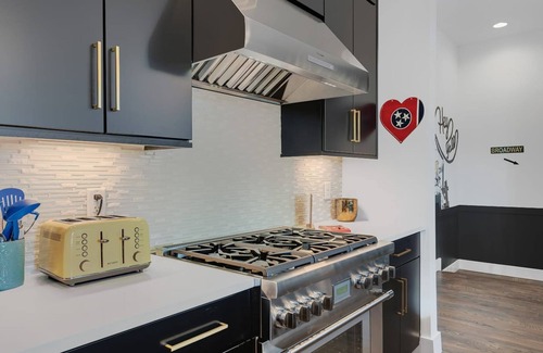 Katie Hill Neighborhood Casa | Speakeasy Rooftop Decks Hot Tub Karaoke