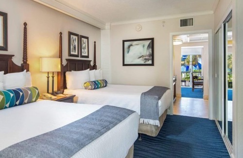 St. Pete Beach Hotel | Steps Away from the Beach! 2 Rooms with Tropical Views, Outdoor Pools!