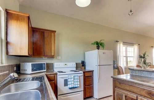 Boca Ciega Villa | Impresionante villa frente al mar con piscina privada, muelle y relajante balcón.