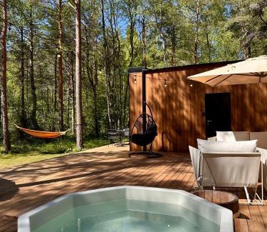Laane-Nigula Parish Casa | Telise TinyOne is a modern forest cabin with a cozy hot tub