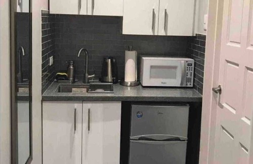 Newtown Apartamento | Tranquility Hotel Suite RD, walking distance to the QPS, Ariapita Ave, & EV Zoo,