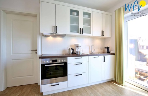 Wangerooge Apartamento | Vacation with a sunny balcony and your own beach chair on the beach