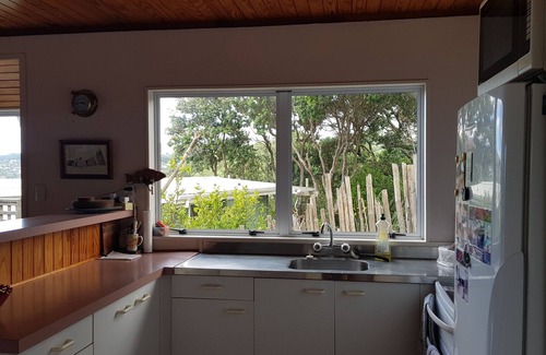 Langs Beach Casa | Virtually beachfront family bach, secluded Ding Bay (Langs)