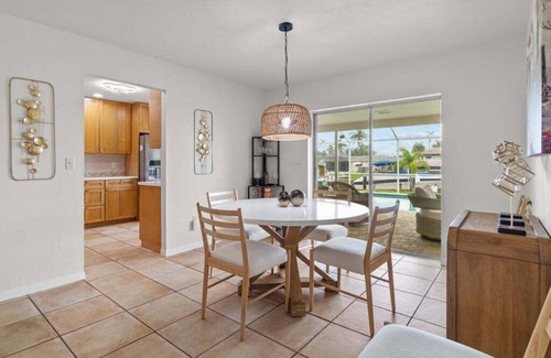 Caloosahatchee Casa | Waterfront Serenity beckons you to experience the ultimate canal-side retreat in stunning Cape Coral