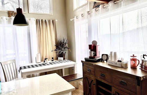 Center Ridge Casa | Watershed Getaway on lake, mountain behind house on property, and hiking trails